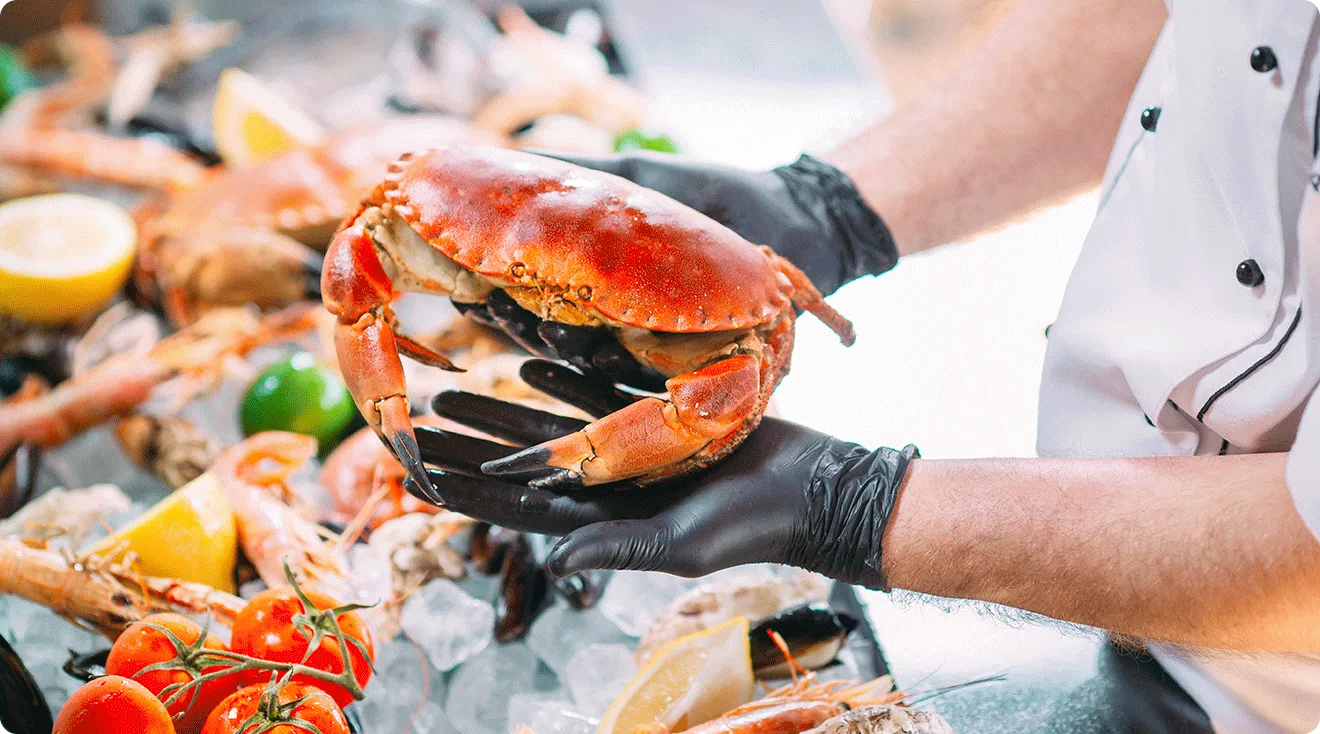chef holding crab