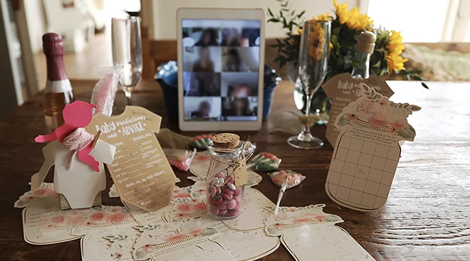 virtual baby shower setup with games and decorations