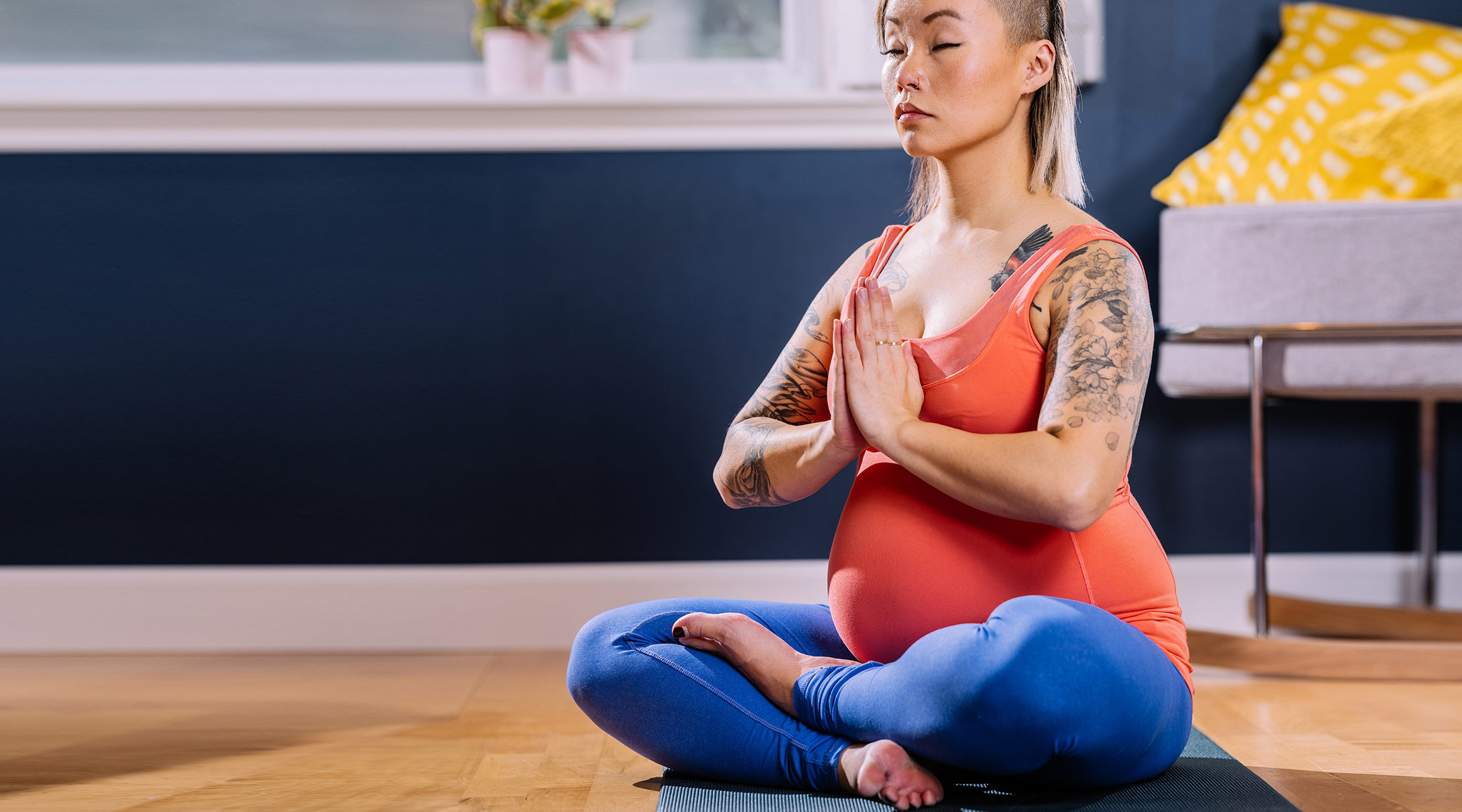 pregnant woman sitting and meditating