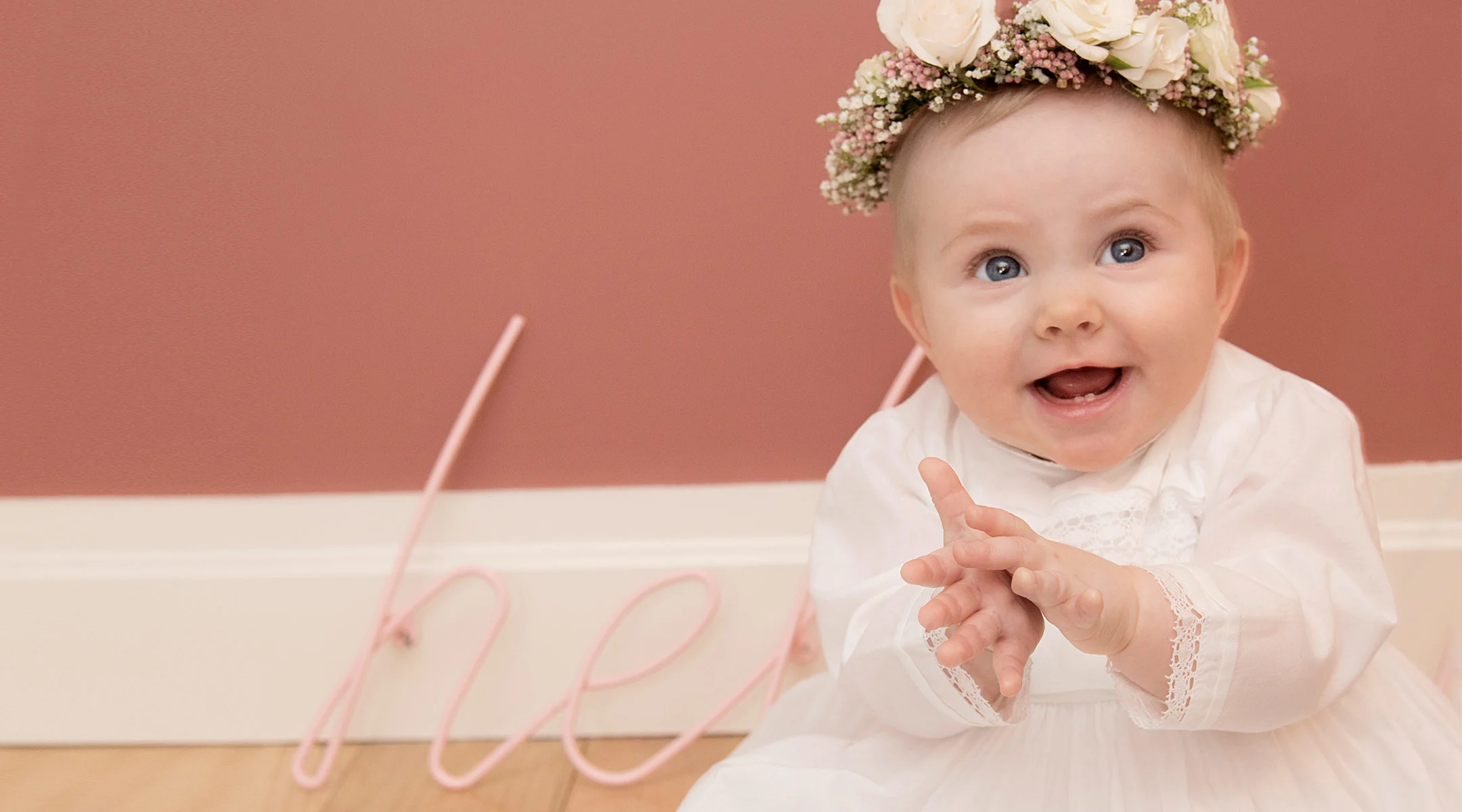 happy baby on her baptism day