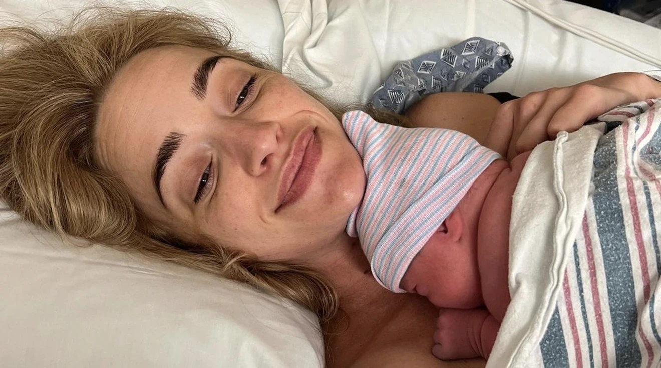 brianne howey and newborn baby in hospital bed