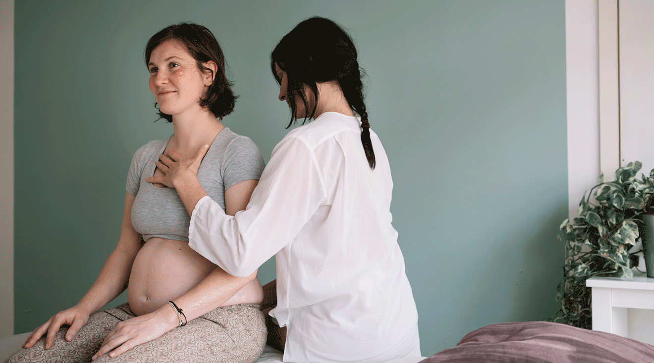chiropractor or osteopath working with pregnant woman