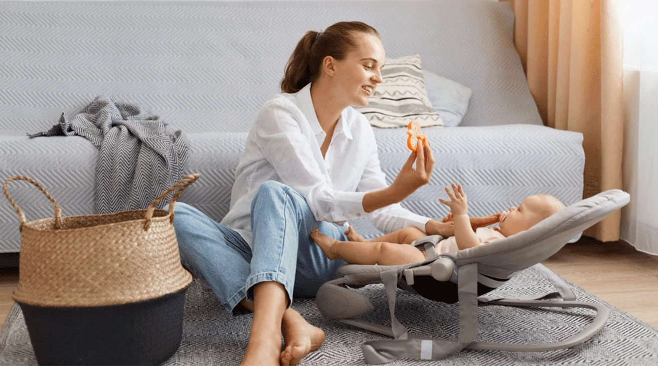 mom showing baby a toy