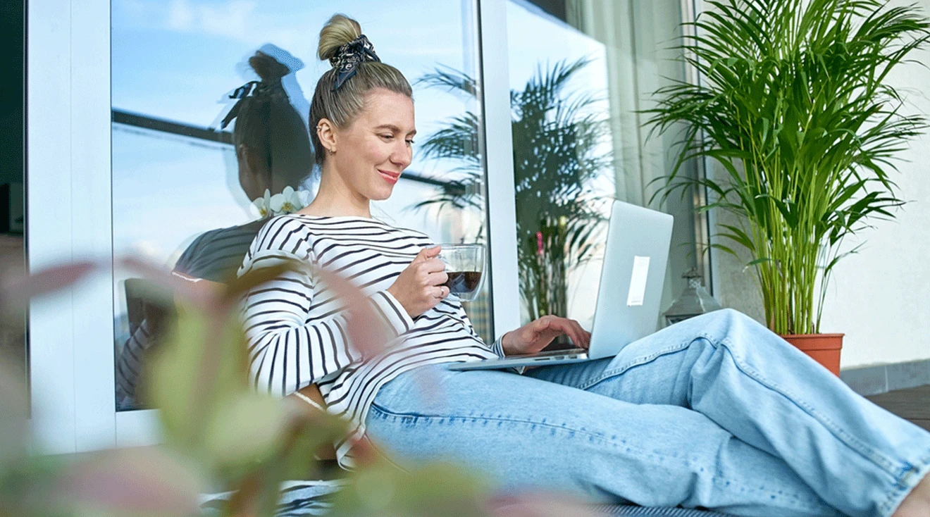 young woman on laptop outside