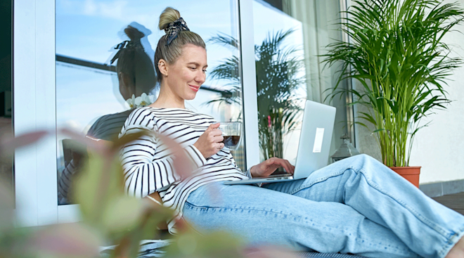 young woman on laptop outside