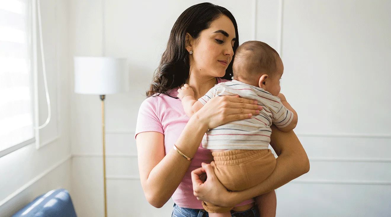 mother comforting gassy baby
