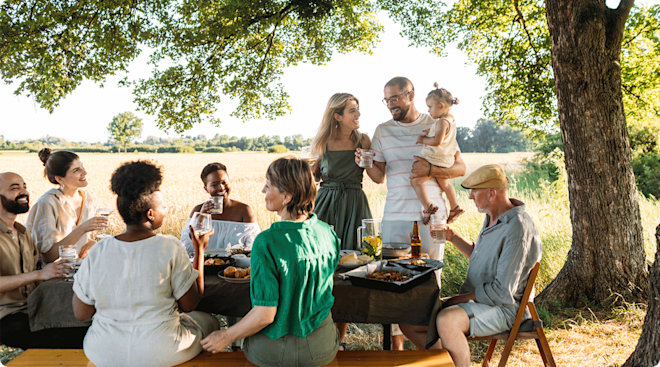 parents with child at a family gathering outside