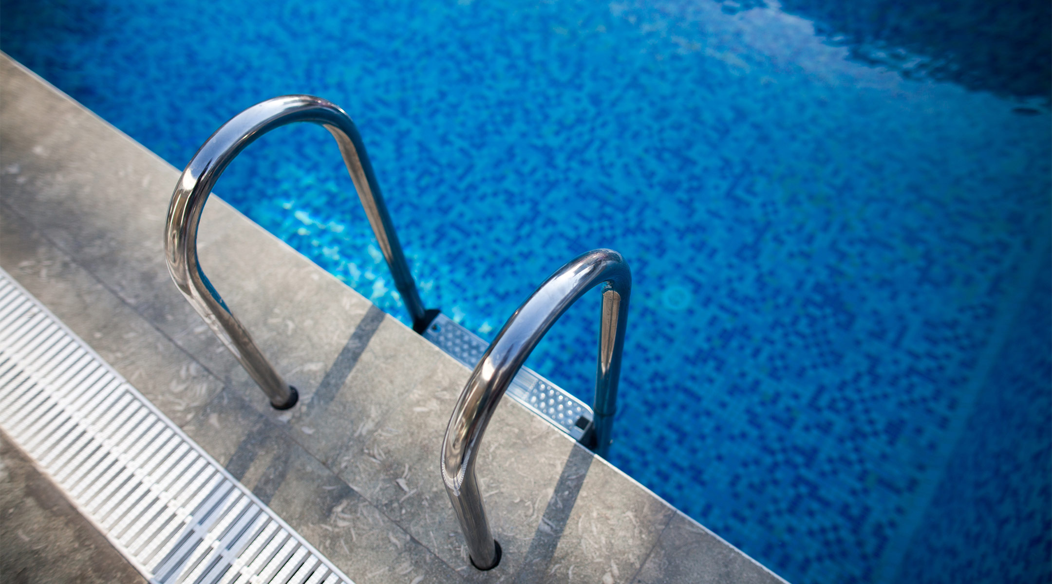 close up of swimming pool with step ladder