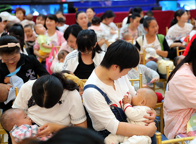 The woman feeding a baby stock image. Image of breast - 5858683