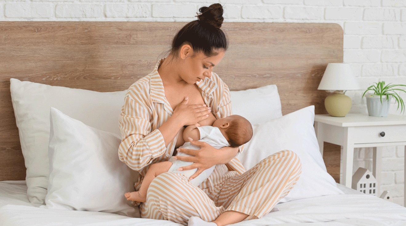 mom breastfeeding baby at home