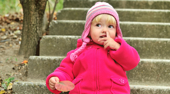 toddler girl picking her nose