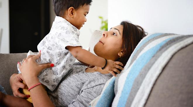 mom hanging out with her toddler on the couch