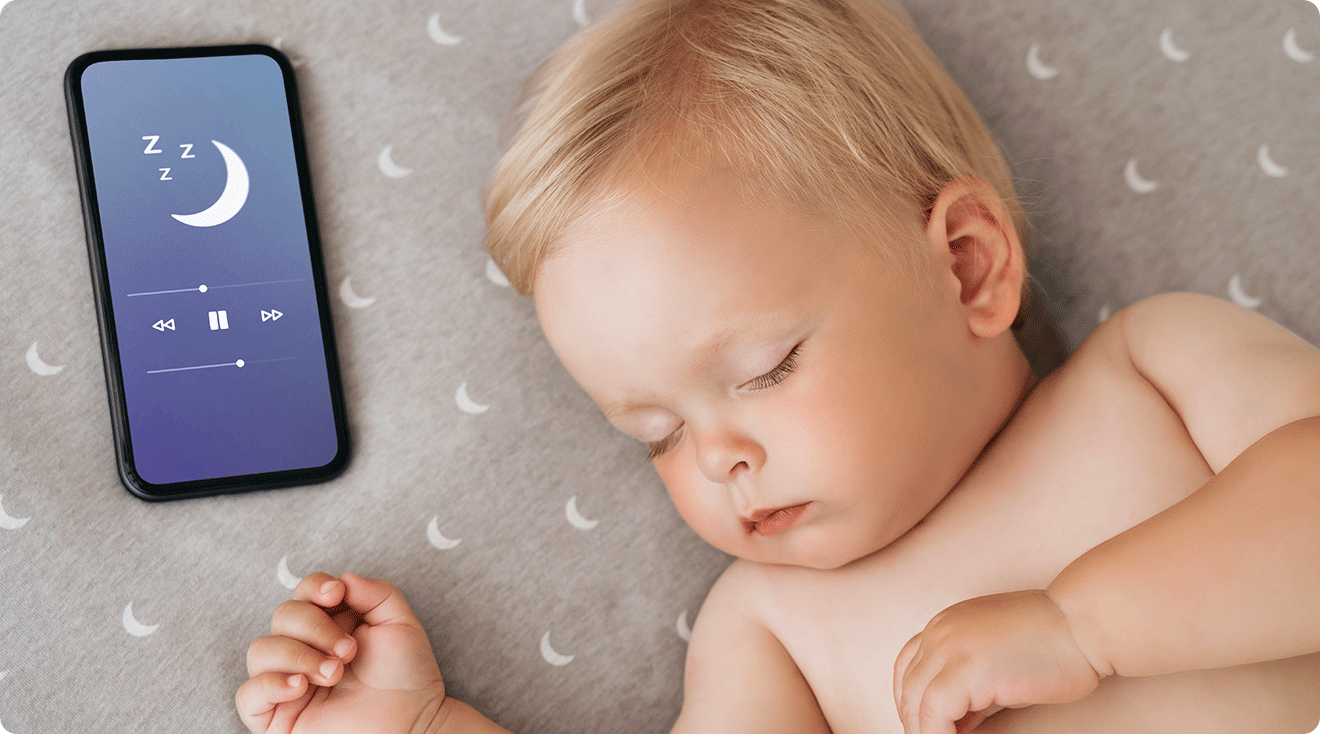 sleeping baby listening to lullaby on smartphone