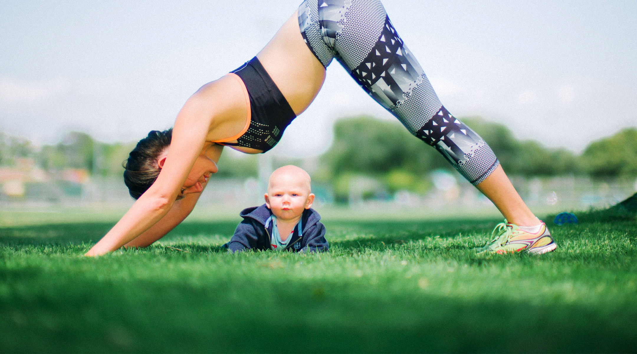 new mom practices fitness routine outside
