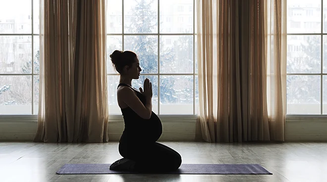 pregnant woman doing yoga