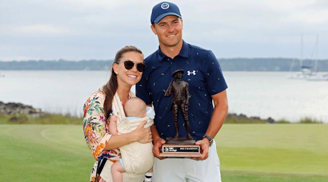 Jordan Spieth poses with the trophy with wife Annie Verret and son Sammy Spieth after winning the RBC Heritage in a playoff at Harbor Town Golf Links on April 17, 2022 in Hilton Head Island, South Carolina