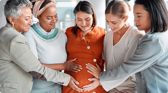 group of friends supporting pregnant woman
