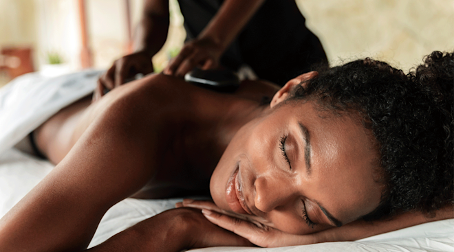 woman getting a massage at a spa