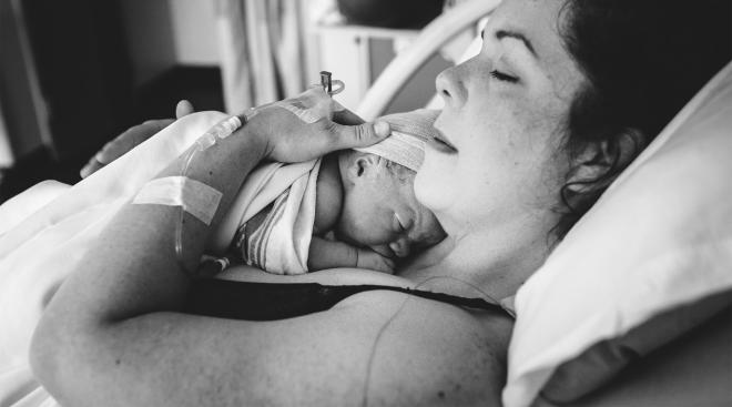 mom rooming in with baby in the hospital after giving birth