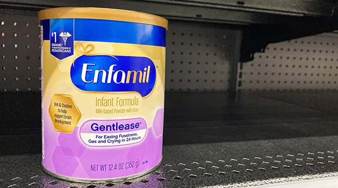 baby formula on empty shelf in grocery store