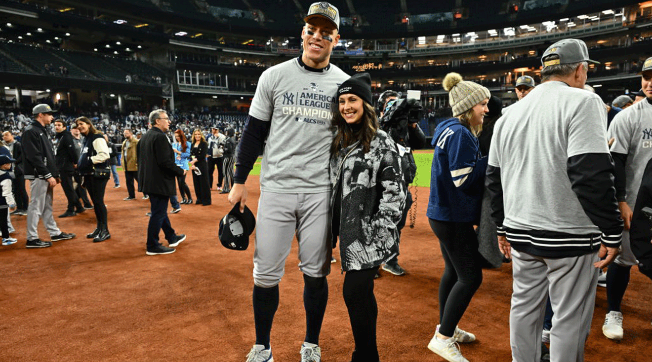 Aaron Judge #99 of the New York Yankees and wife Samantha Bracksieck pose for photos after the New York Yankees beat the Cleveland Guardians