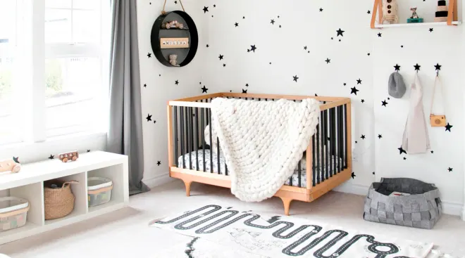Gender neutral baby nursery black and white theme with stars on the walls