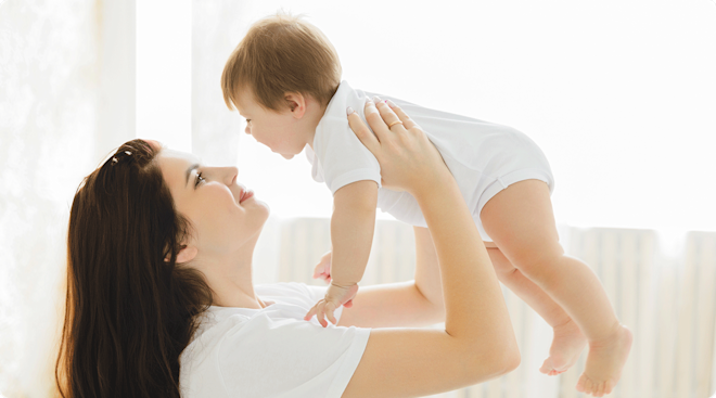 mom holding 7 month old baby