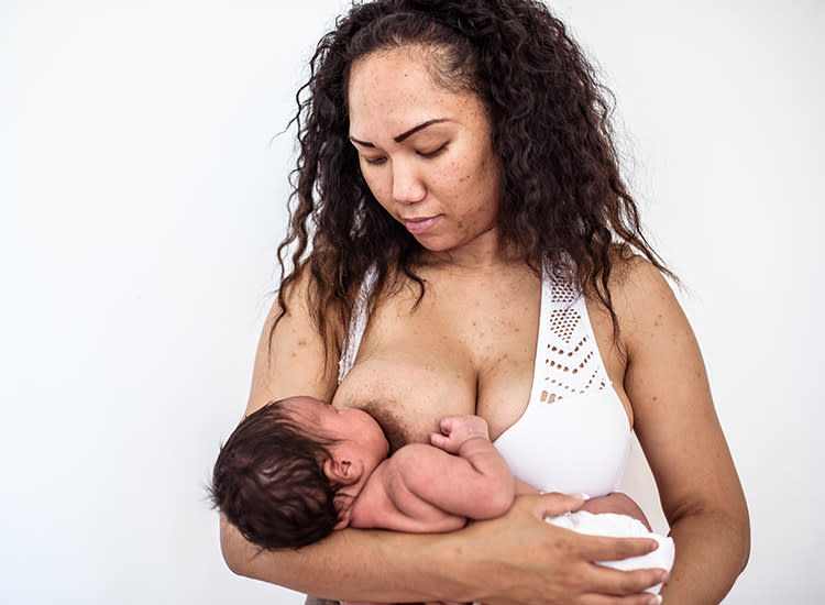 The woman feeding a baby stock image. Image of breast - 5858683