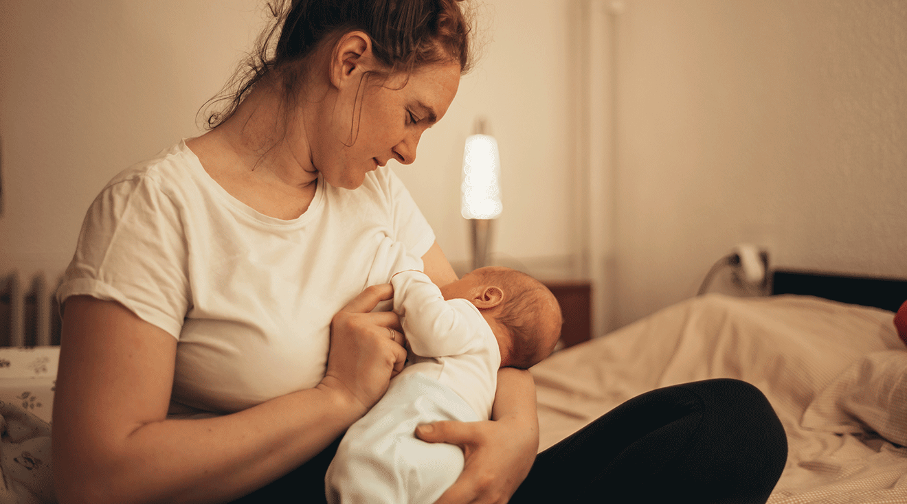 sad mother breastfeeding baby