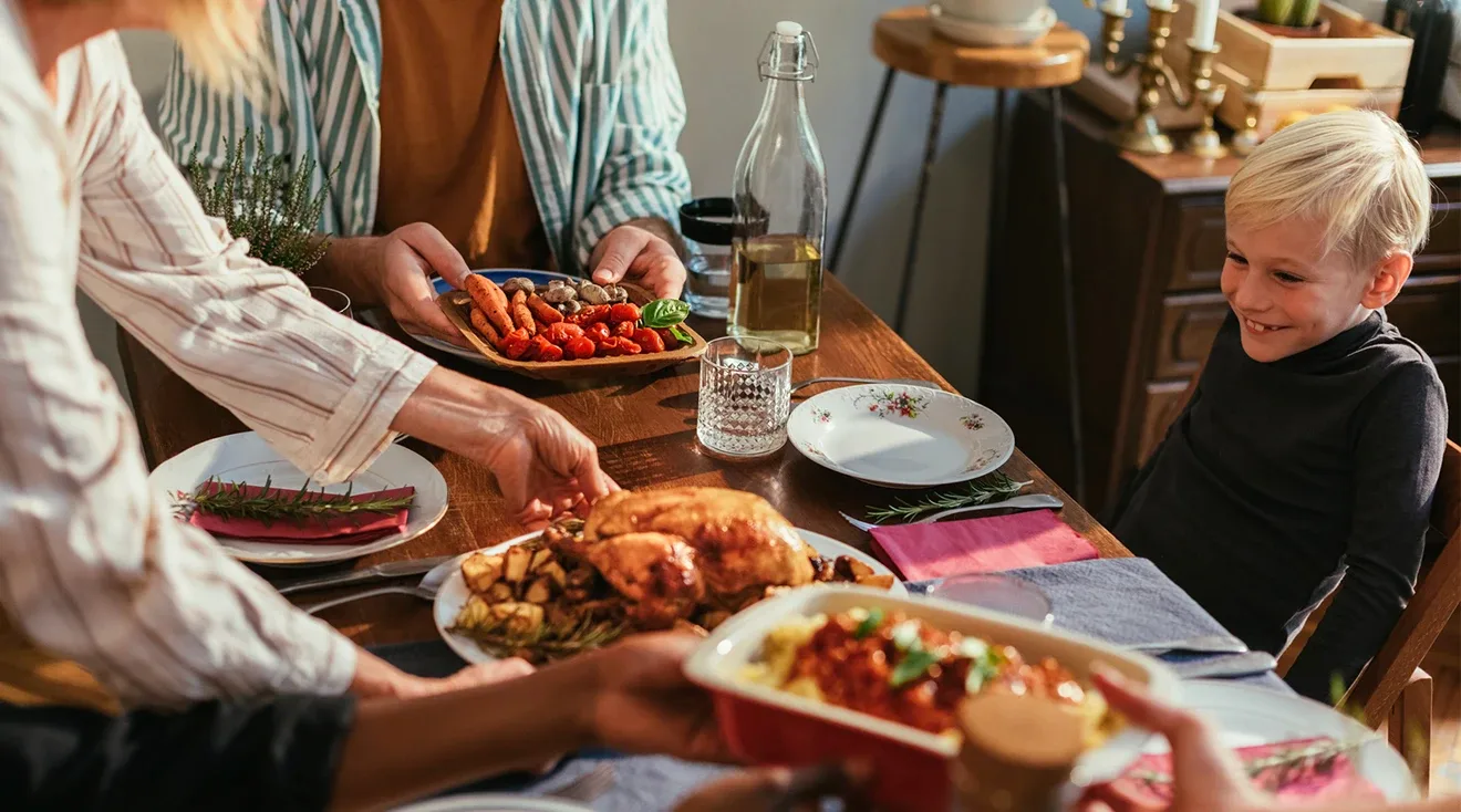 child smiling at thanksgiving dinner
