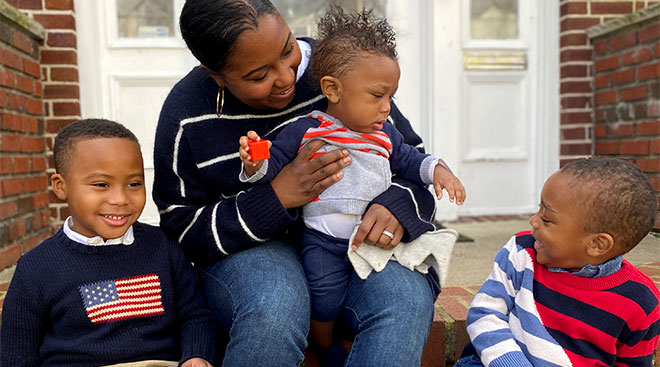 The author Jen Lee pictured with her three black sons on her stoop. 