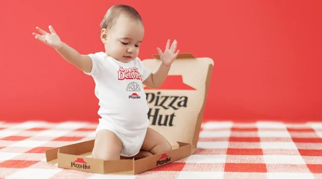baby wearing carter's pizza hut onesie