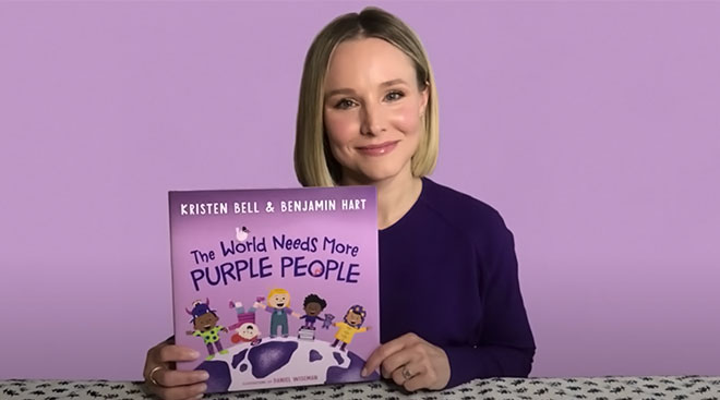 actress Kristen bell holds her new book, the world needs more purple people