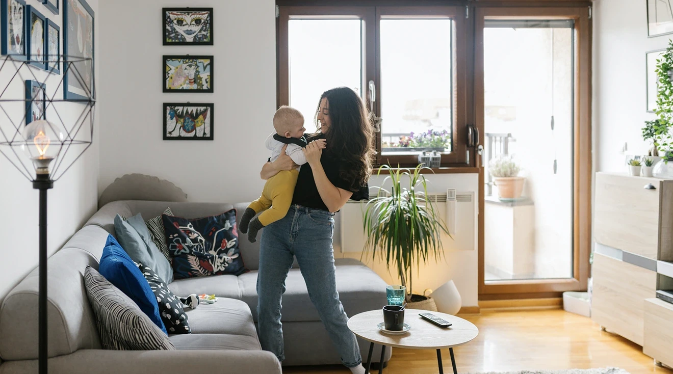 mom and baby dancing in living room