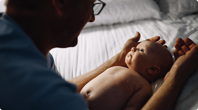 daad comforting infant at night