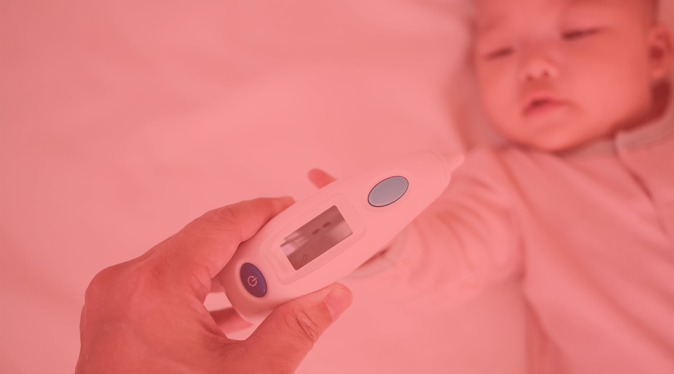 parent taking baby's temperature