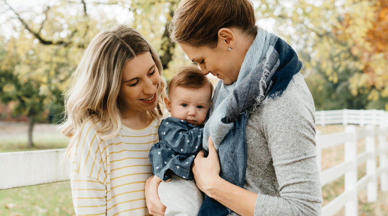 two mothers with their baby