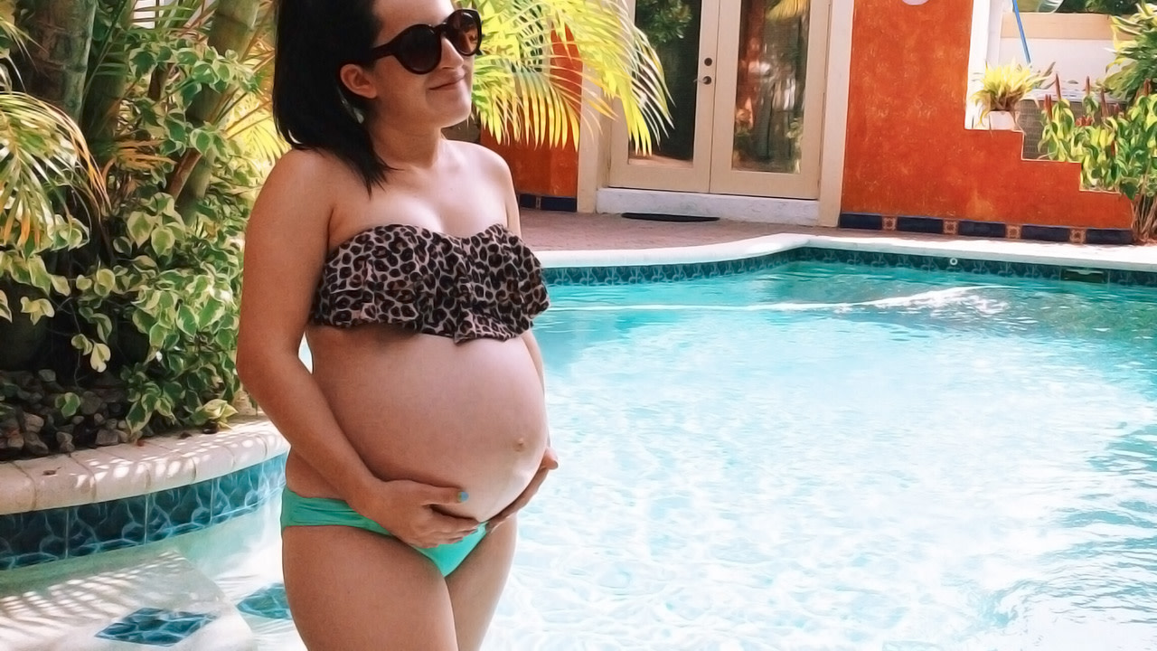 pregnant woman in bikini on vacation in the pool