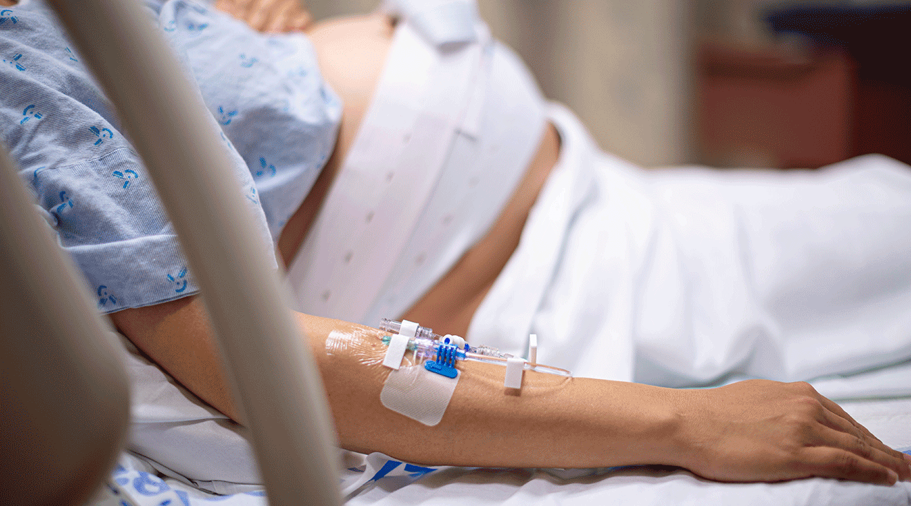 pregnant woman with IV in arm during labor