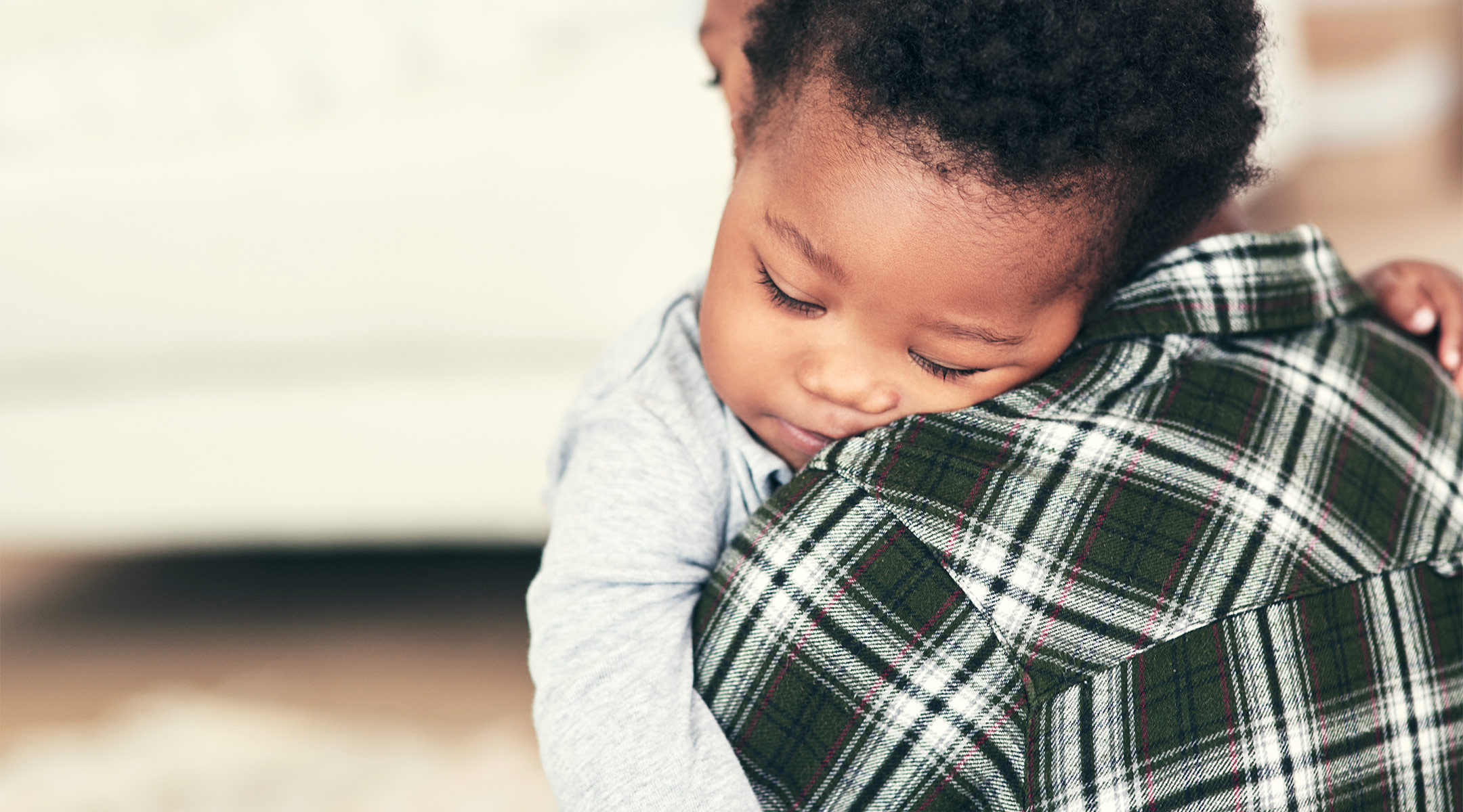 mom taking care of sick toddler at home