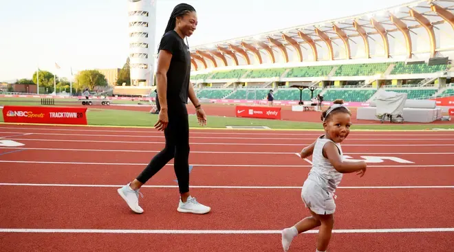 Alyson Felix and Daughter running on the track together
