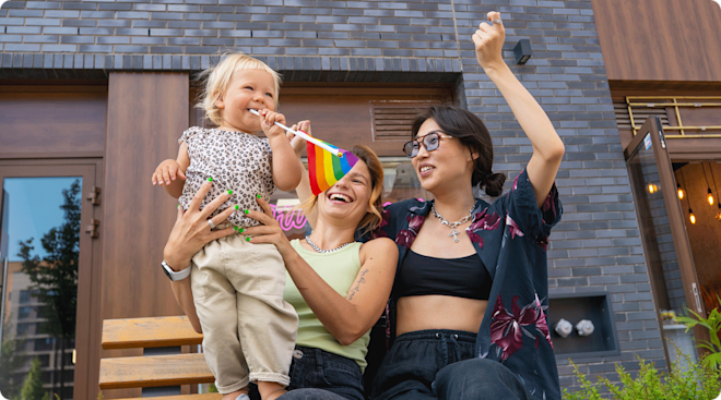 LGBTQ family with baby celebrating pride month