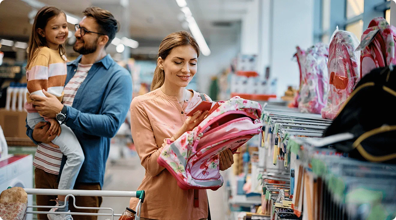 family going back to school shopping for school supplies
