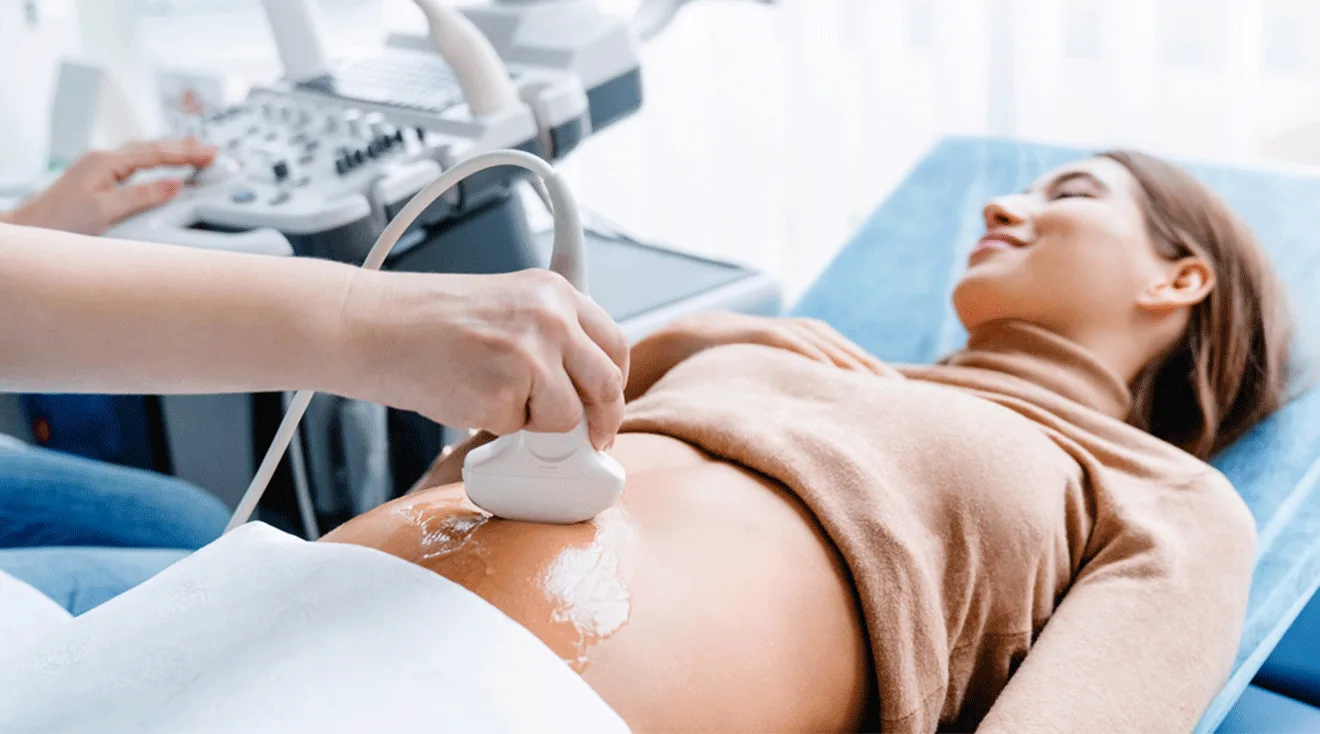 pregnant woman in first trimester getting an ultrasound