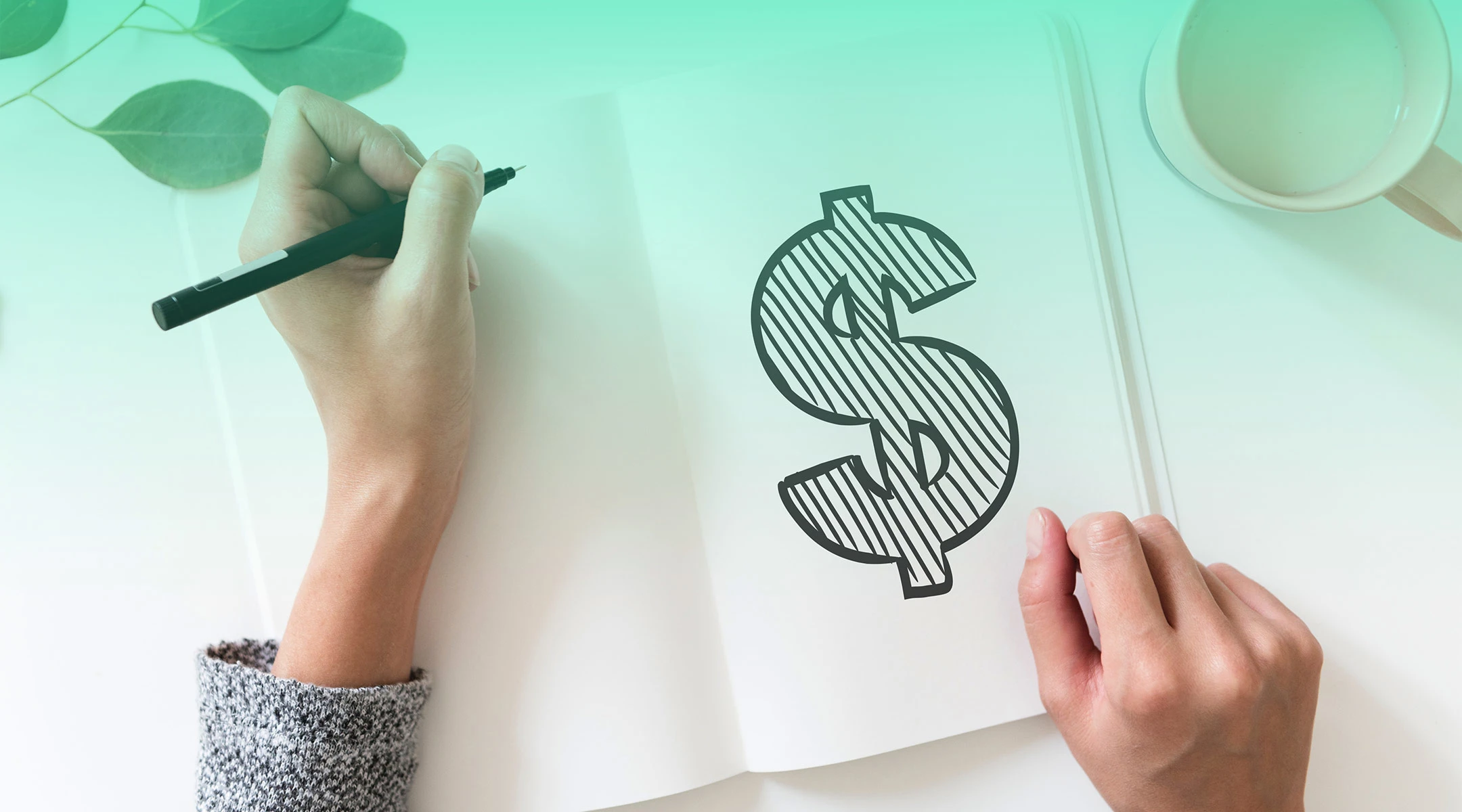 hands drawing money sign in notebook