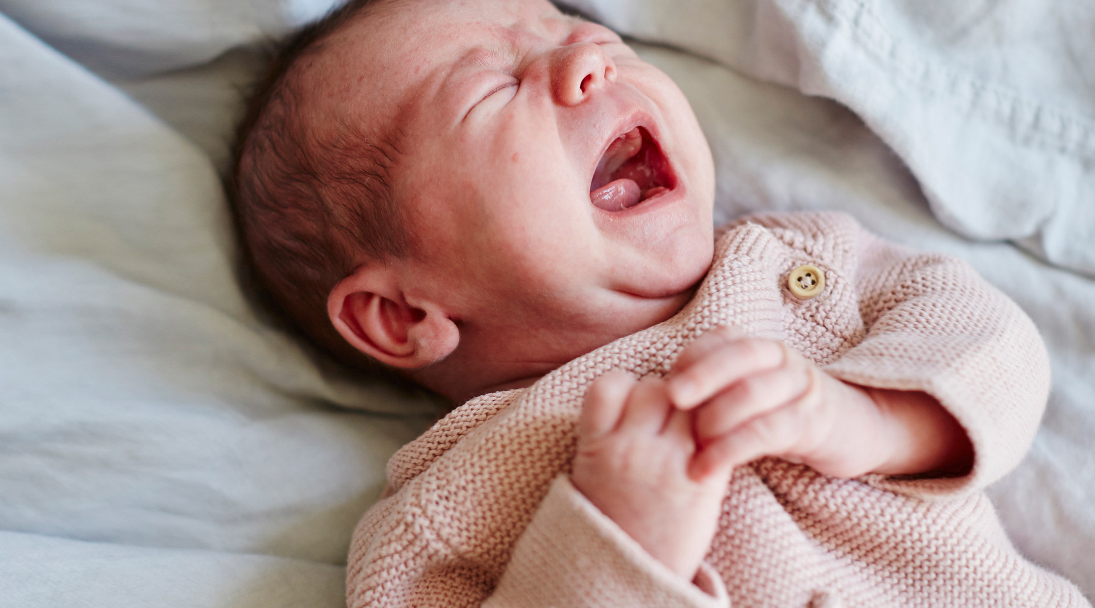 baby crying due to hand foot mouth disease