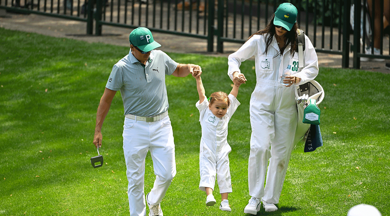 Rickie Fowler with his wife, Allison Stokke, swing their daughter, Maya, during the Par-3 Contest, prior to Masters Tournament at Augusta National Golf Club on April 10, 2024 in Augusta, Georgia