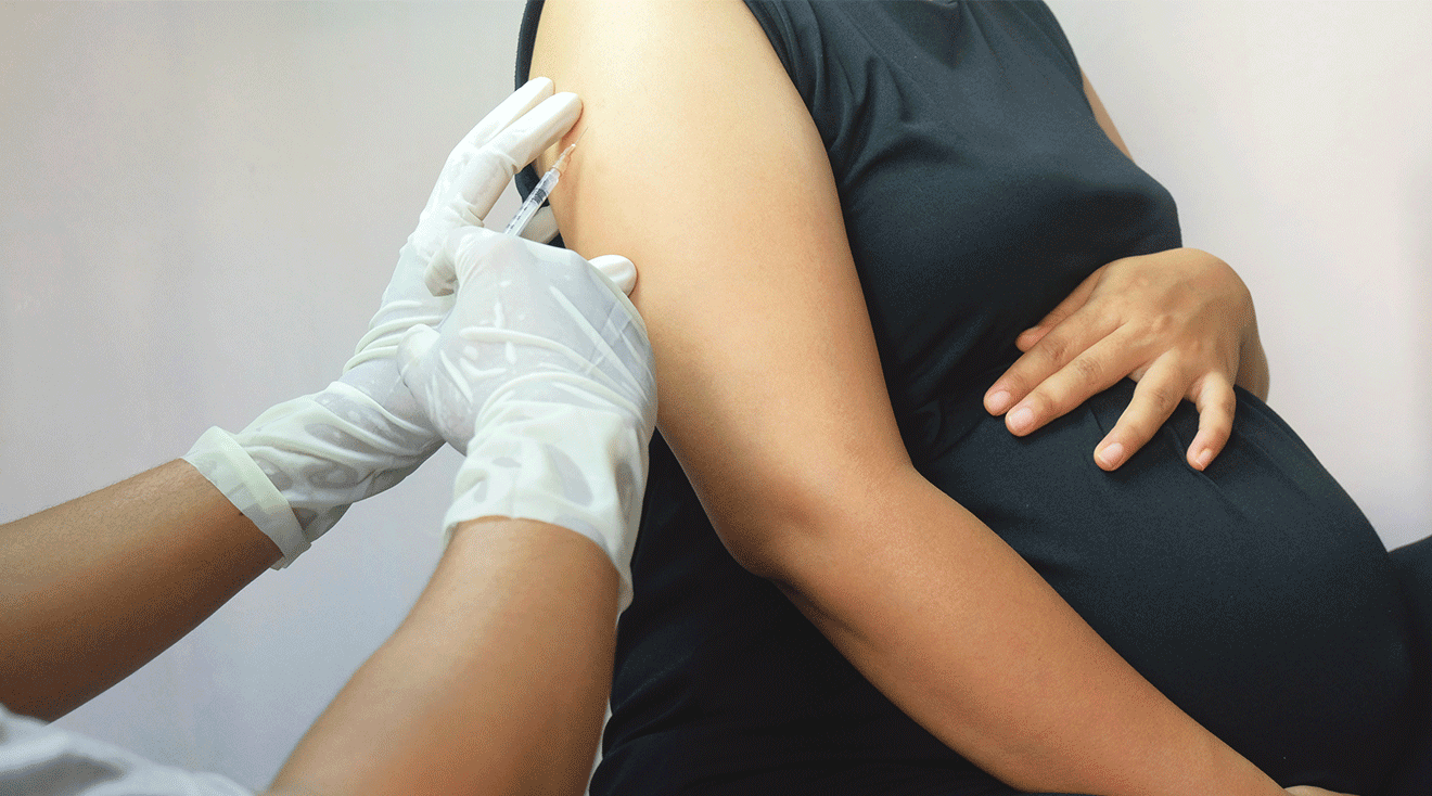 pregnant woman getting a flu vaccine