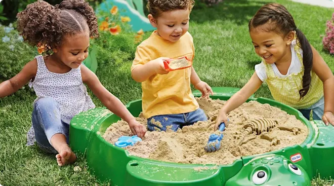 Children playing with the Little Tikes Turtle Sandbox