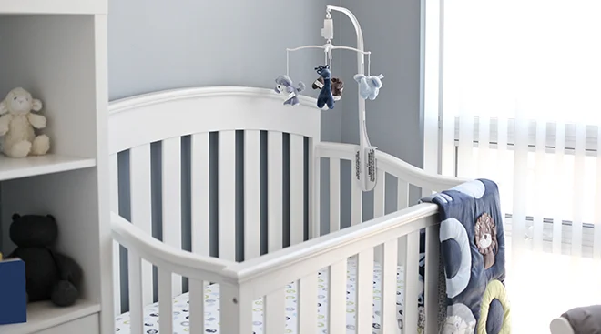 crib in baby boy nursery at home